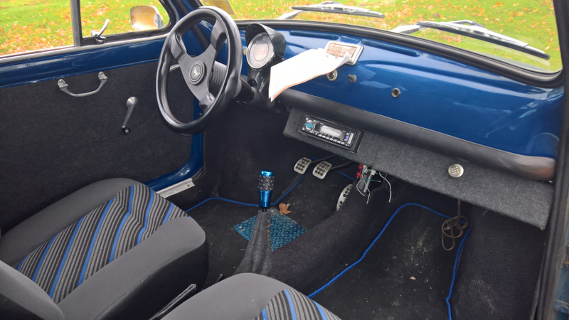 aftermarket seats, radio box and new carpets.